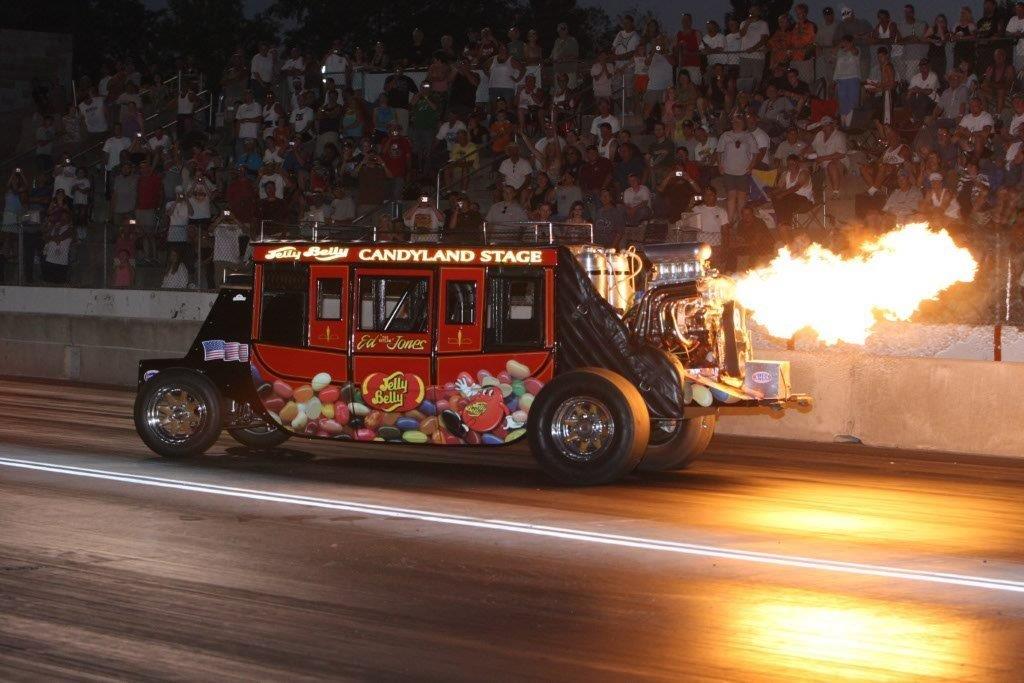 stagecoach on racetrack with flames